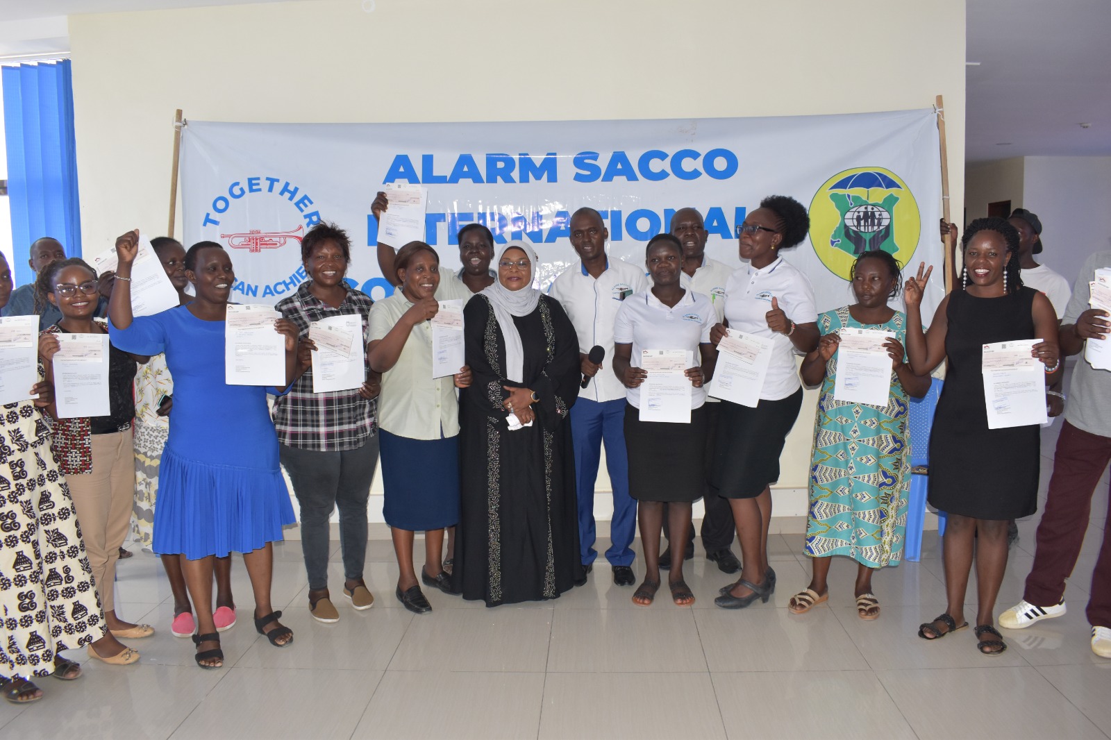 Smiles and applause after a certificate presentation