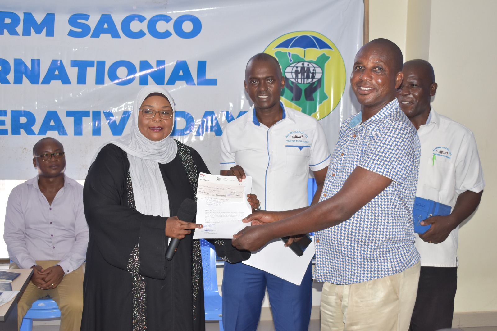 Official issuing a certificate to a member